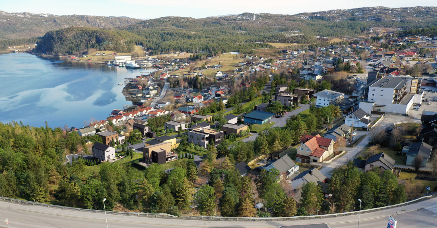 aerial view on the city with lake and hills