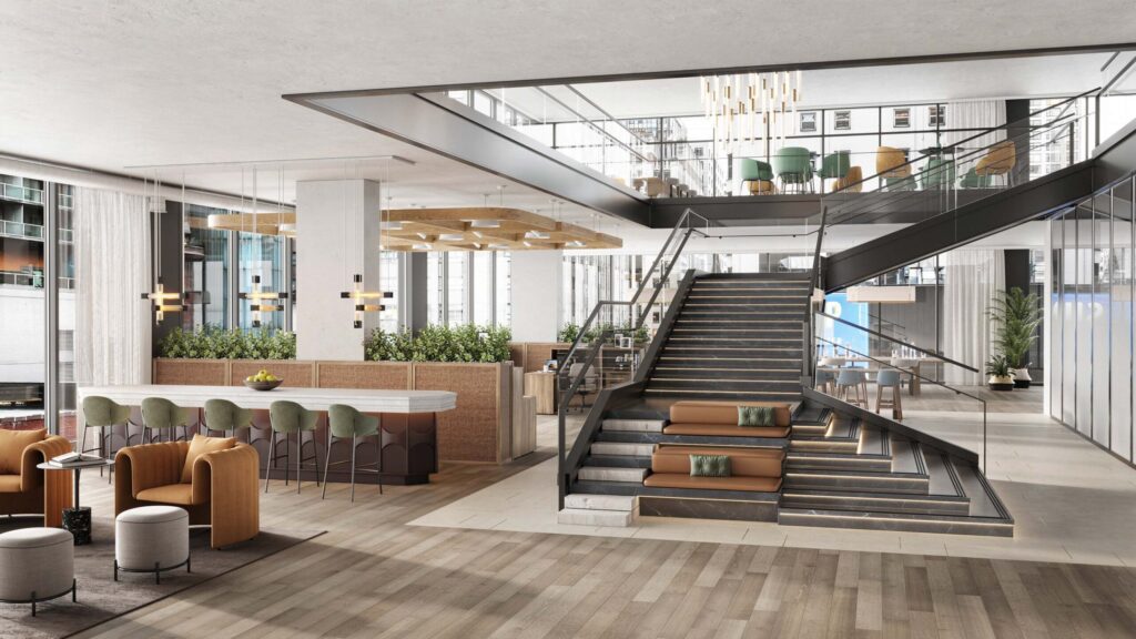 Residents’ lobby with a feature stair and mezzanine, amenity rendering for a Mavrek building