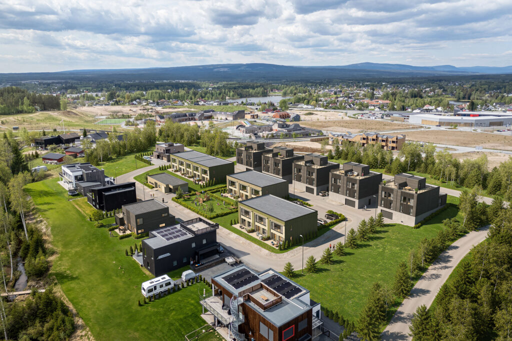 Rendu architectural aérien d’un quartier résidentiel avec plusieurs bâtiments et espaces verts