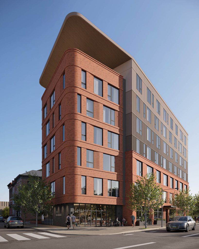 Rendu extérieur d’un immeuble résidentiel en brique avec balcons et environnement végétalisé