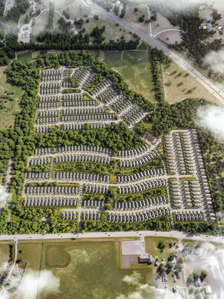 3D site plan rendering of a townhouse community with tree-lined streets, aerial view