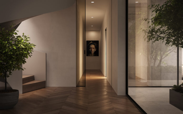 perspective to the aisle with picture on the wall, stairs, and glass wall inside a house