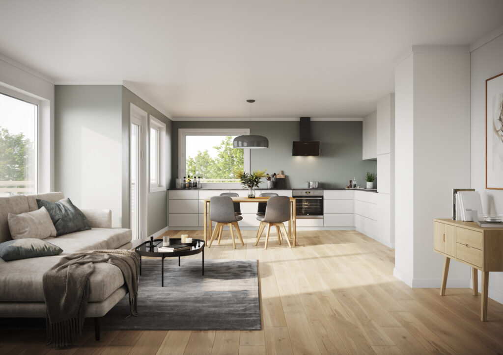 White kitchen with green walls and grey sofa in daylight