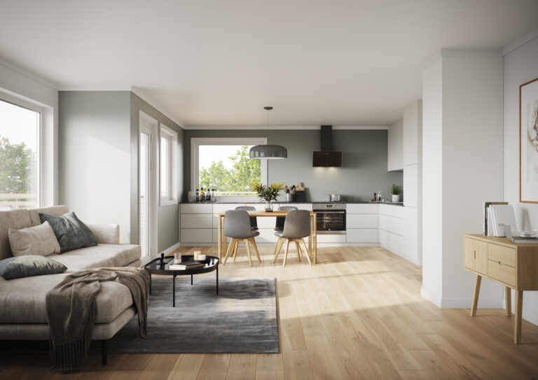 White kitchen with green walls and grey sofa in daylight