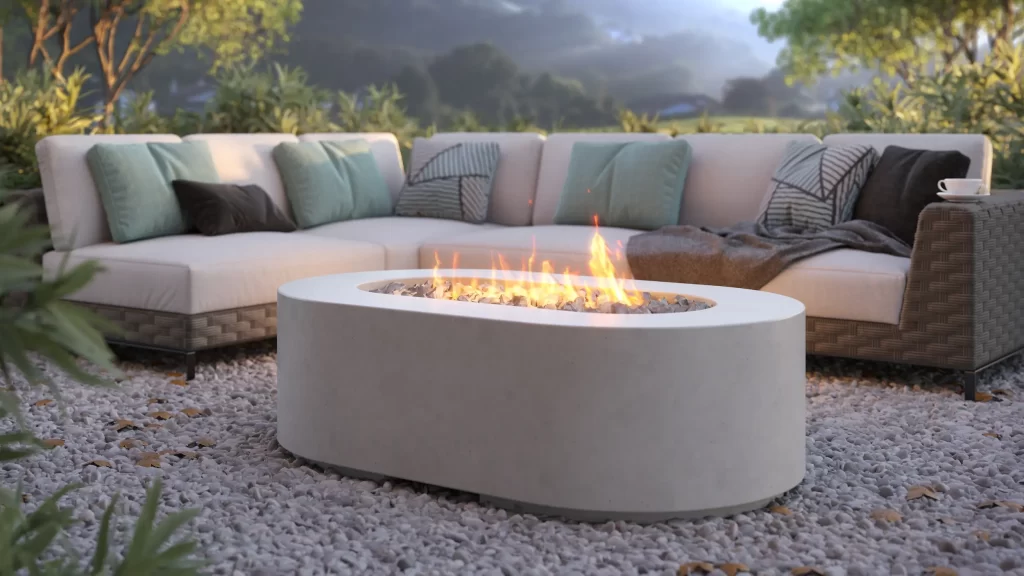 Rendu 3D produit d’un brasero ovale sur une terrasse en gravier avec canapé d’extérieur
